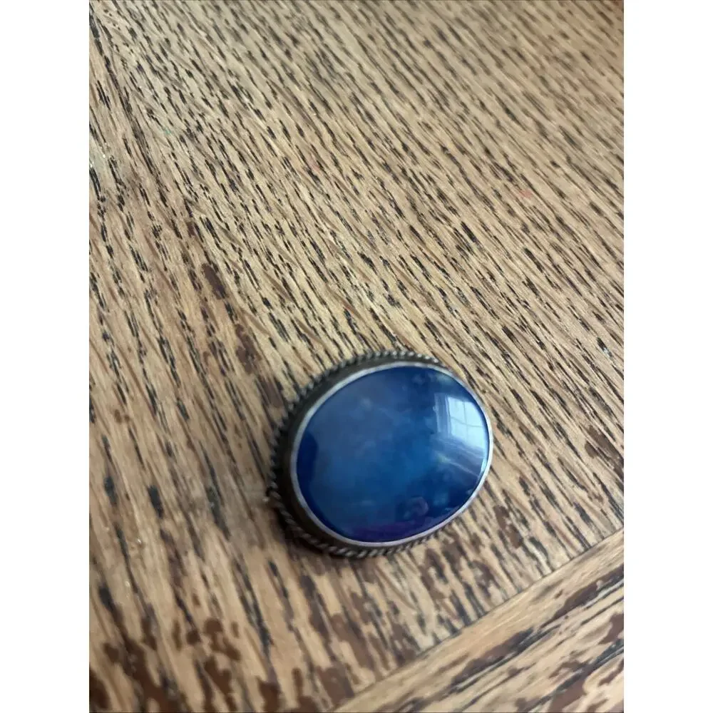 A Vintage Navajo Sterling Silver Sand Cast Brooch With A Lapis Cabochon